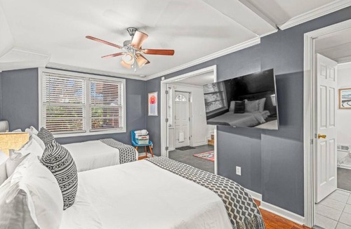 East Side House | Vibrant Hidden Bookcase Door 4Bd Garage Game Room