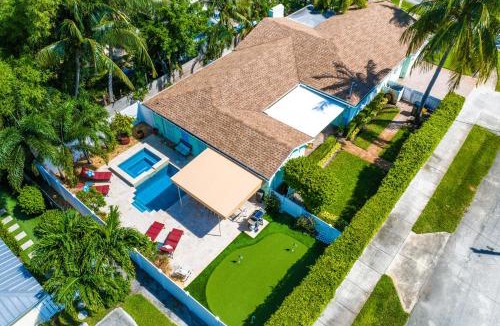 Del-Ida Park Historic District House | Walk to The Ave- Heated Pool, Spa, Golden Tee and Putting Green - mins to Beach- by Maven Vacation Rentals