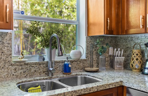 Southwest House | 🌴 Your Private Boho Oasis Awaits! Relax in a stylish 2BR retreat just 2 miles from Downtown West Palm Beach. Lounge by your saltwater pool, cozy up by the firepit, and enjoy a getaway that feels like a boutique vacation every day.