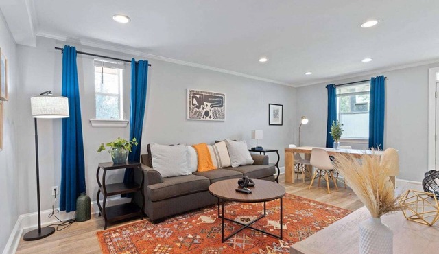 Bright 1BR/2BA Garden District condo with wrap balcony, gated parking, pet-friendly, steps to Magazine