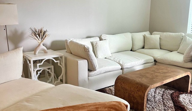 Chic 2-bedroom deluxe apartment with king beds, large Tvs, and a fitness center.