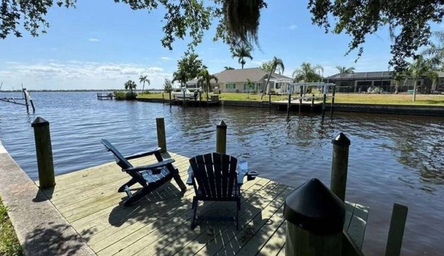 Cozy and private waterfront retreat with hot tub, grill, deck, and firepit!