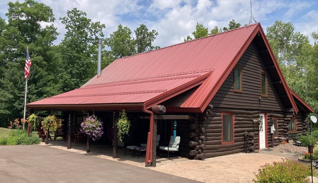 Custom built log home on 40 acres & in the woods! Snowmobile right from home!
