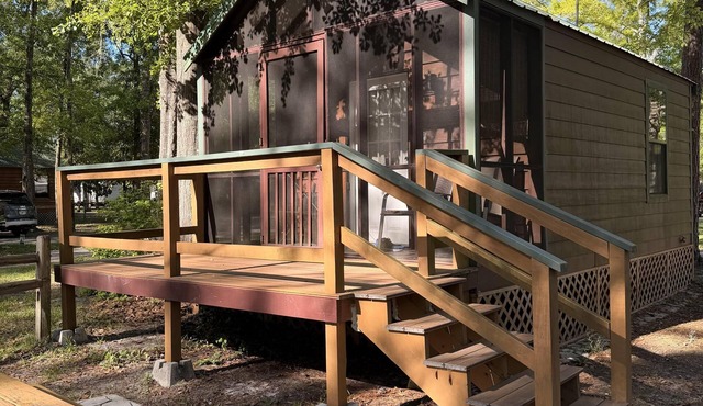 Deluxe Cabin - The River Otter Lodge - Our Deluxe Cabins offer comfort with a true Okefenokee feel. Climate controlled, private, and set in a quiet part of the campground.