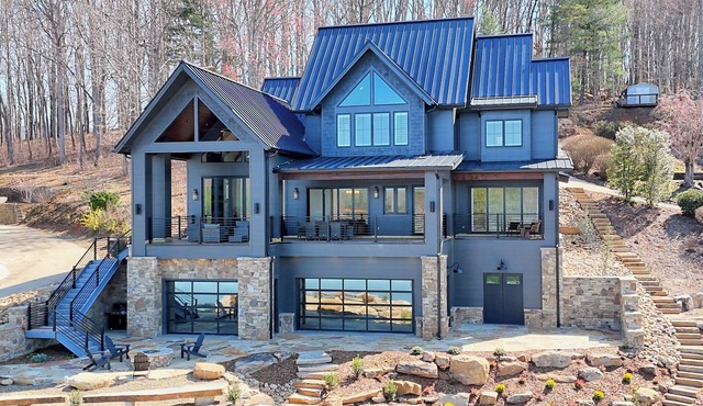 Endless Sunsets by Chatuge Home Concierge | Lakefront home with private dock, covered boat slip, sun deck, hot tub, bar, fire pit, pool table, kayaks and EV charger. The perfect spot to relax, play, and enjoy unforgettable sunset views.