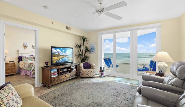 Enjoy this beachfront 2BR condo in Ponce Inlet with a ground-level patio offering direct access to pool and beach. Features a heated pool, fitness room, and clubhouse. Master has a king bed with private bath; guest room includes a king and two twins
