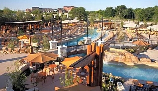 Featuring a 10-acre outdoor pool facility and a European-style spa .