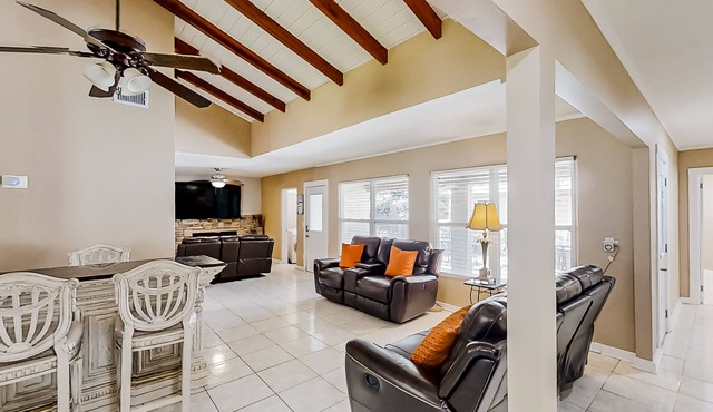 Home near the beach & golf with inviting patio, fireplace, AC, & washer/dryer