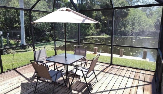 Octagonal 2-story West Palm waterfront home w/dock, boat ramp, & private parking