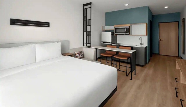 Rest in a Comfortable Room After Exploring Newnan | Pet-Friendly Stay