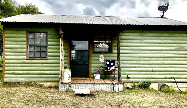 Rustic cabin with peaceful view of windmill, pond and great sunsets. Gated.