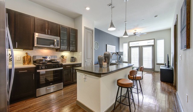 Stunning 1bd suite with warm and bold interiors, great amenities, & a pool view.