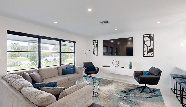 Stunning single level home with, heated pool, kitchen, & fully equipped BBQ area