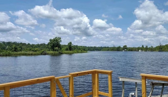 This beautiful 3-bedroom 2-bathroom Riverfront home is a great place to unwind.