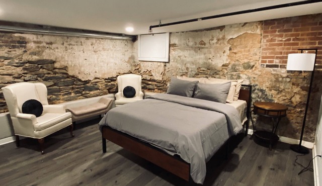 Unique brick basement apartment directly on Adamson Square!