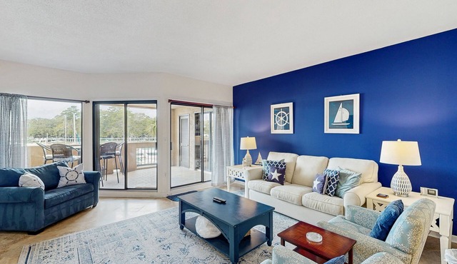 Waterfront condo with walkable locale, central AC, washer/dryer, & shared pool