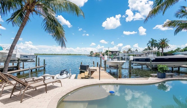 Waterfront Getaway with Boat, Pool & Walk to Beach